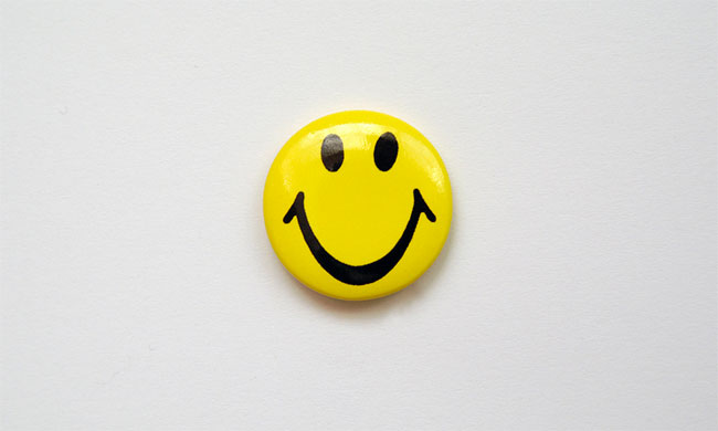 Smiley pin badge